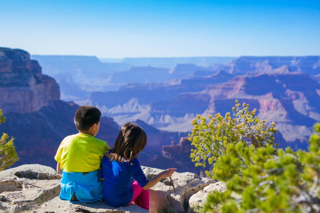 Kids watching the view to Grand Canyon