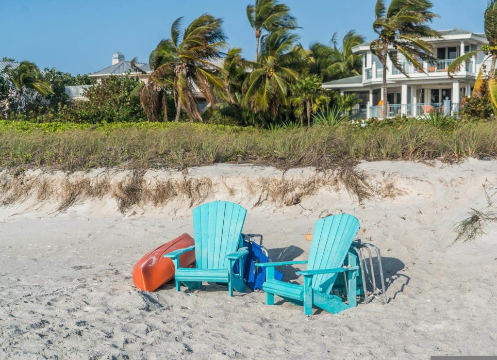 captiva islands shore beach two blue chairs