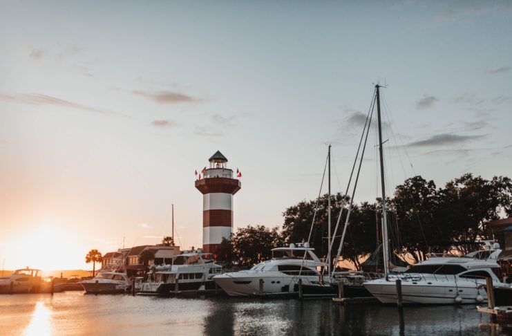 hilton head island harbour and lighthouse at sunset